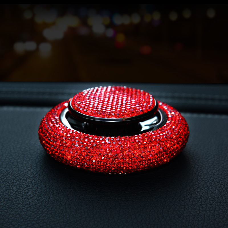 Prism crystal car fragrance bottle on a dashboard