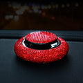 Prism crystal car fragrance bottle on a dashboard