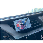 Record player vent diffuser clipped to a car air vent