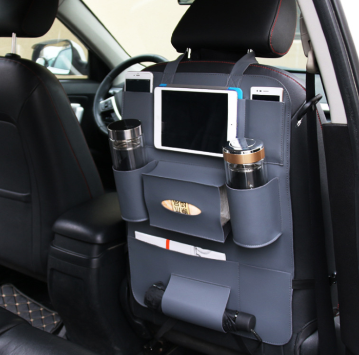 The grey organizer fitted to a seat back with a tablet and drinks in place