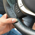 Perforated anti-slip grip detail on the fibre leather wheel cover