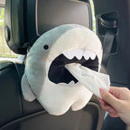 Shark tissue box holder sitting on a car centre console