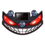 Solar devil eye window light – grinning face design, front view