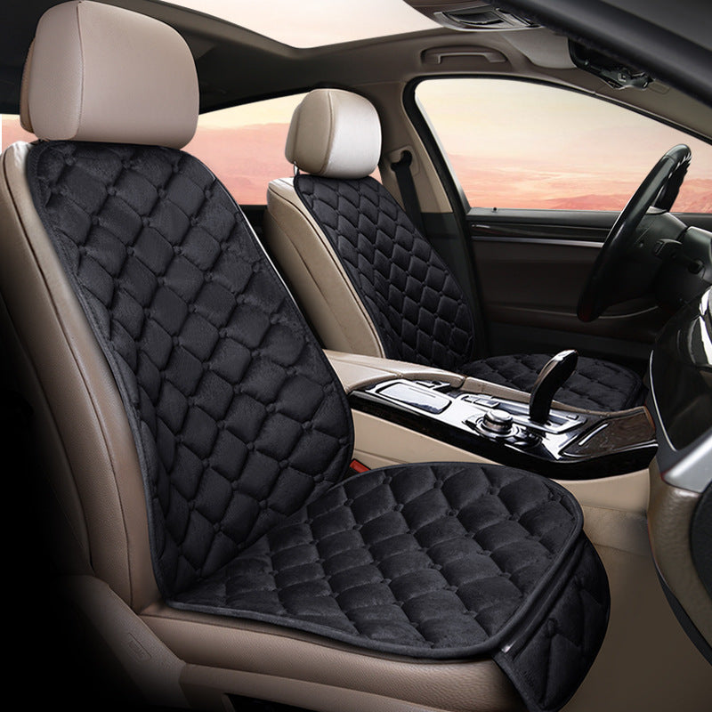 Black plush winter seat cushion on a car seat