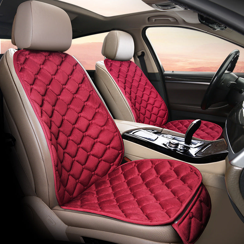Wine red plush winter seat cushion on a car seat