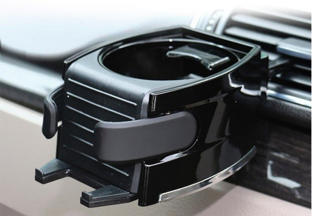 Air vent drink holder clipped to a car vent, opened to hold a cup