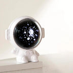 White astronaut galaxy projector with a starry visor