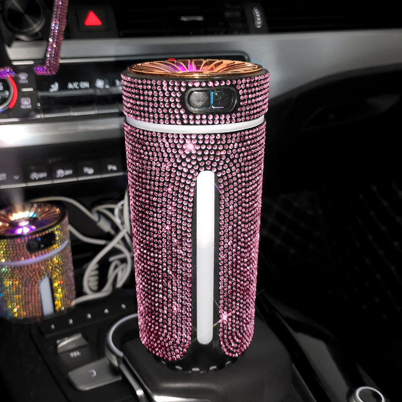 Pink crystal diamond car humidifier in a cup holder