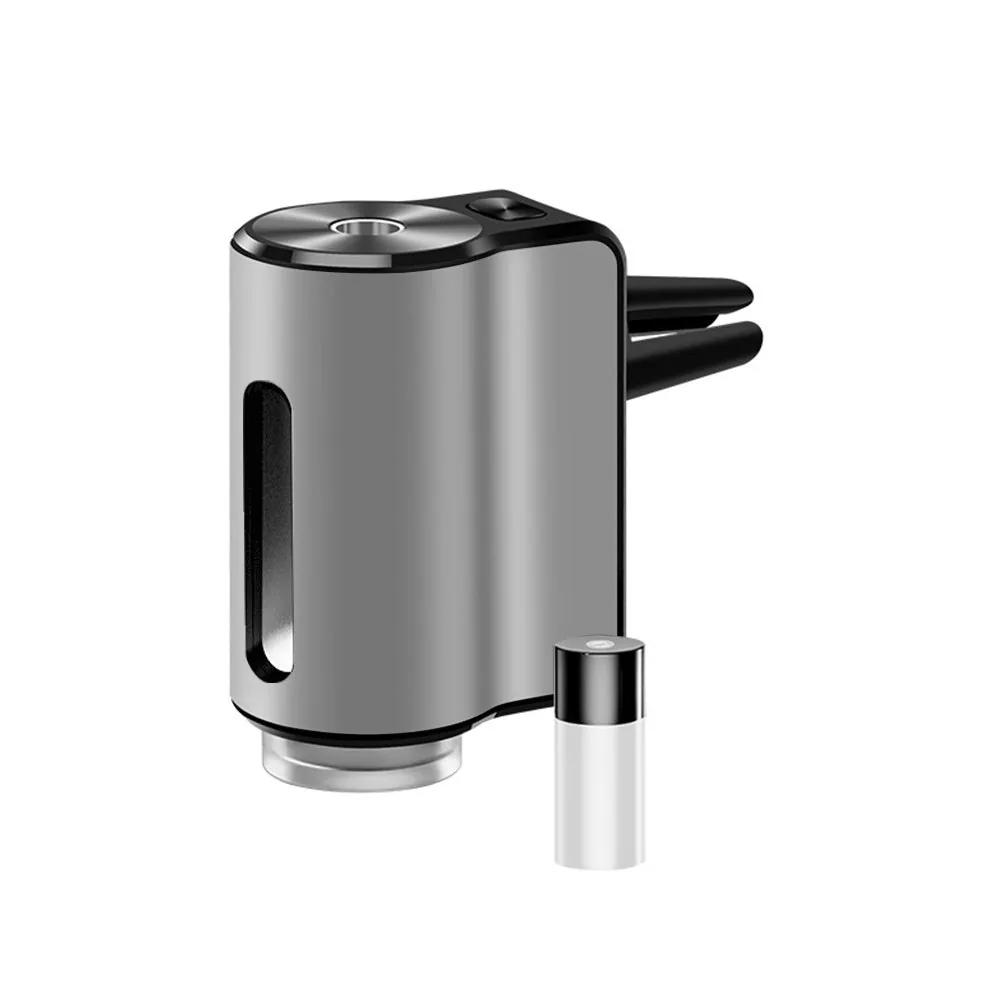 AromaDrive smart car diffuser in silver, with one essential oil bottle