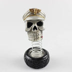 Officer Cap Skull — skull dashboard ornament in an officer's cap on a spring-mounted tyre base