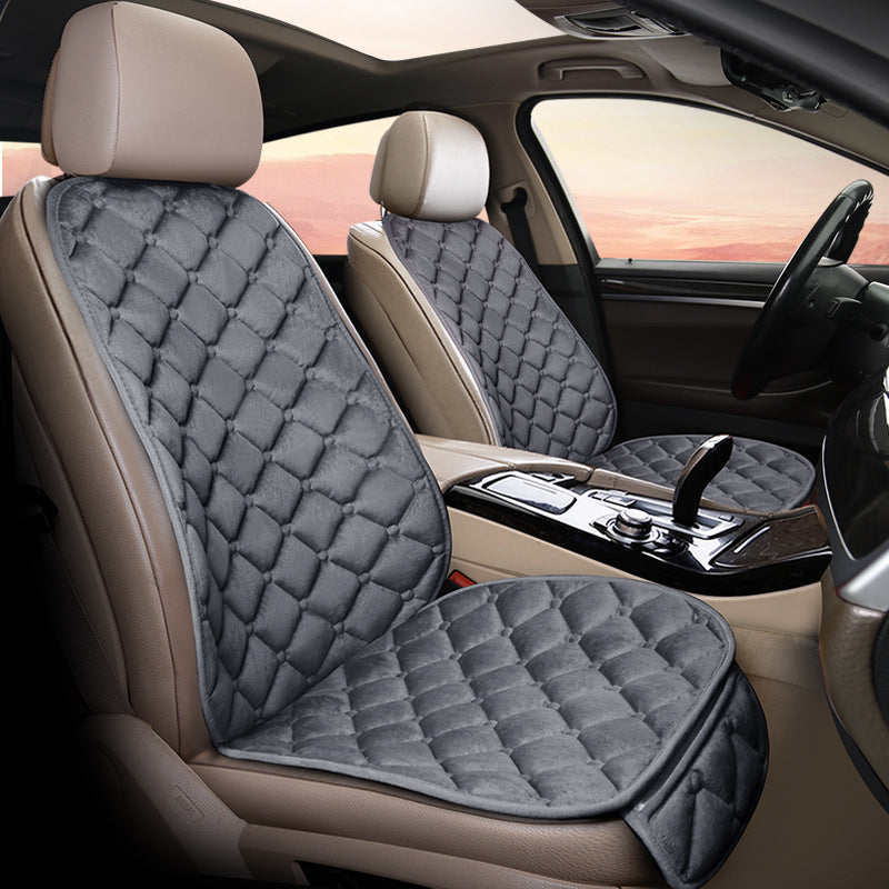 Grey plush winter seat cushion on a car seat
