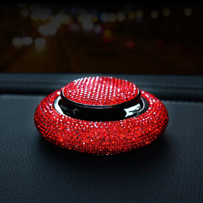 Crystal Car Air Freshener in use — red rhinestone unit sitting on a leather dashboard at night