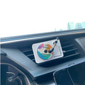Fresh Cabin Kit: white record player diffuser clipped to a car air vent
